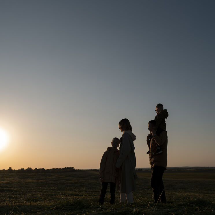 Full shot family silhouette having fun sunset