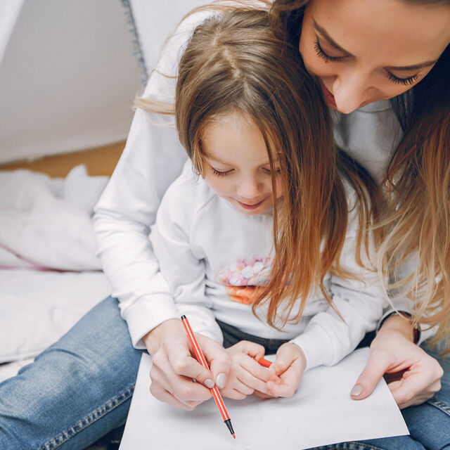 Mother with little daughter home